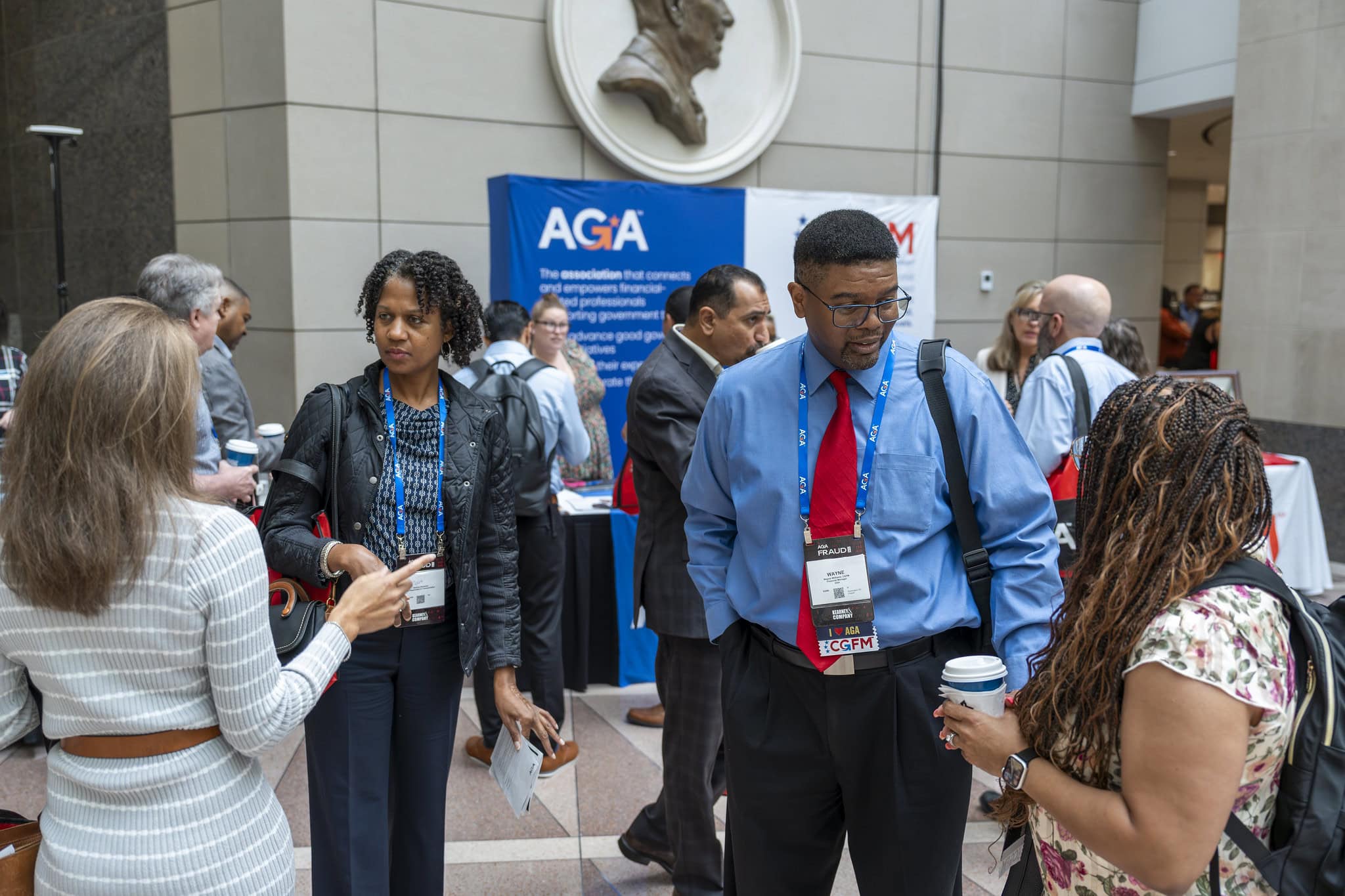 AGA event attendees network with each other in the Solutions Hall